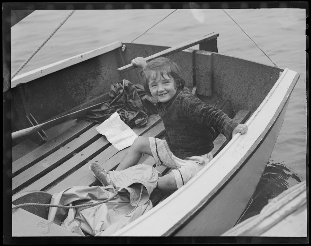 Sailing kid in a boat