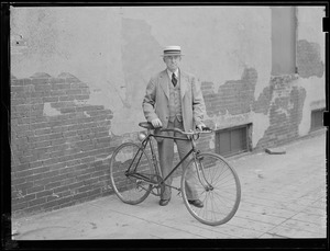 Unidentified man with bicycle
