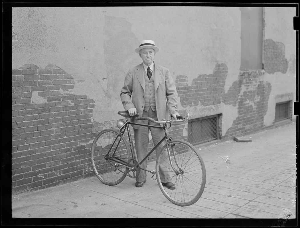 Unidentified man with bicycle