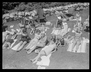Sun bathers on lawn