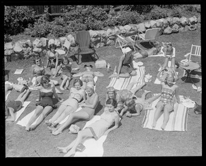 Sun bathers on lawn