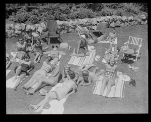 Sun bathers on lawn