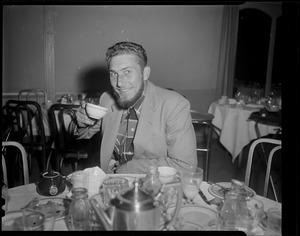 Man with Lincoln beard enjoys a cup of tea