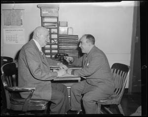 Two men at desk