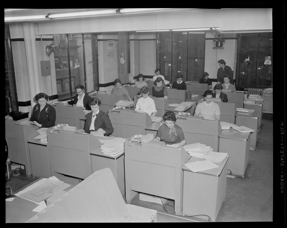 Women typing in office