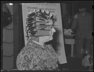 Steam curling contraption on lady's head