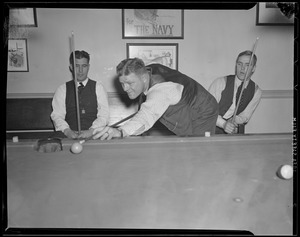 Three men playing pool