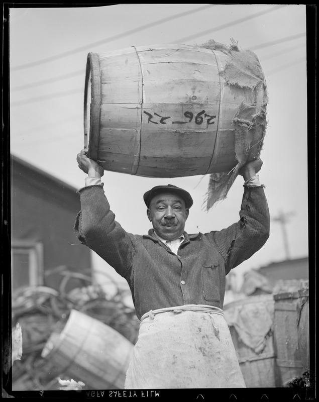 Man lifts barrel over his head