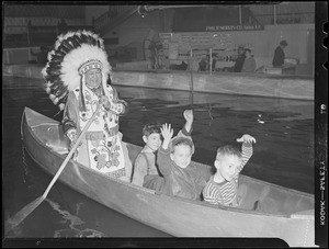 Kids canoe with Indian