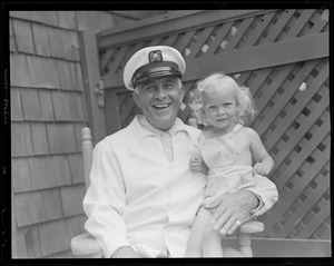 Man in uniform with little girl