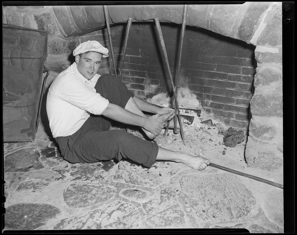 Man holds his feet in the fire