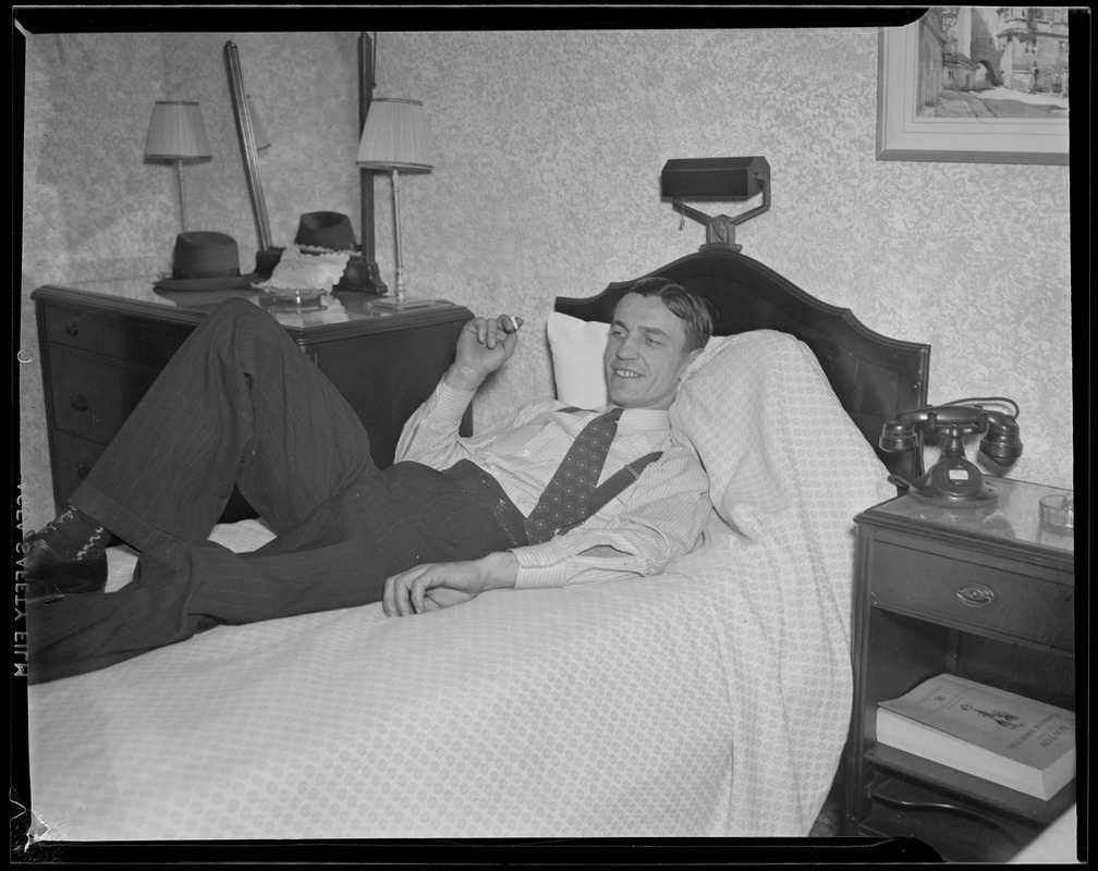 Man reclining in hotel room