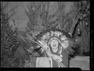 Woman with bow & arrow and Indian feathers