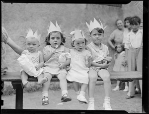 Children wearing paper crowns