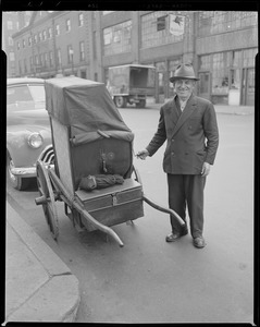 Man with organ grinders cart