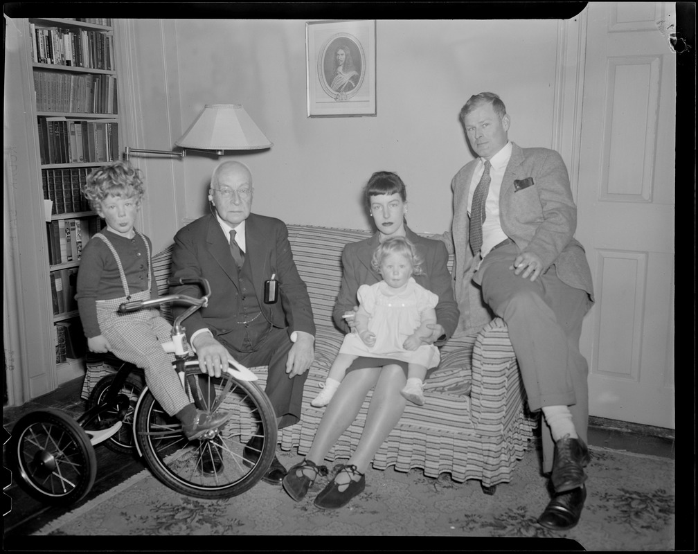 Family poses on couch