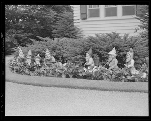 Figures in shrubbery
