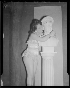 Miss Shaw, model and tease, visits studio of statues