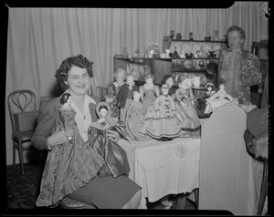 Winifred Lynch Holding 110 yr. old doll (r) and doll of Mary Todd Lincoln (l) dolls from 1870 on table