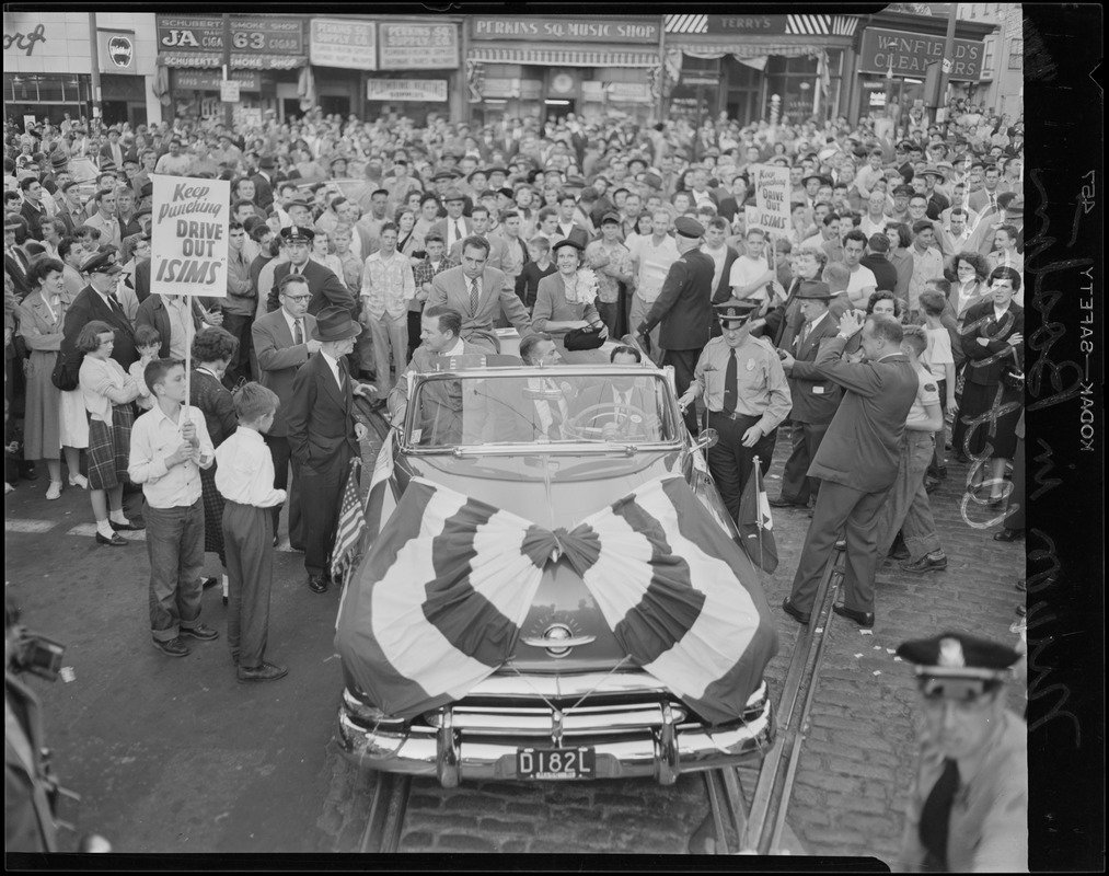 Mr. & Mrs. Nixon in open car in Boston