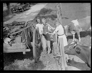 Mrs. Leverett Saltonstall with her son and daughter help Boy Scouts collect scrap in Dover