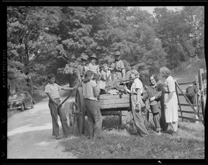 Mrs. Leverett Saltonstall with her son and daughter help Boy Scouts collect scrap in Dover