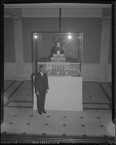 Gov. Leverett Saltonstall poses with model of State House