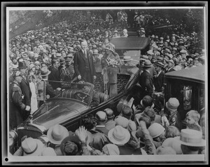 Pres. Coolidge & wife addressing crowd from auto