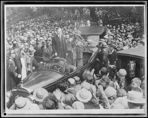 Pres. Coolidge & wife addressing crowd from auto