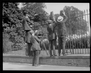 Photographers take pictures over fence when young Coolidge died of blood poisoning