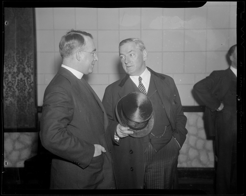 Curley converses with priest
