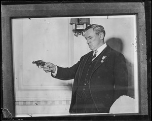 James M. Curley with gun