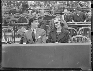 John Roosevelt and fiancée Anne Lindsey Clark watch game in Fenway