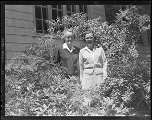 Two women in bushes