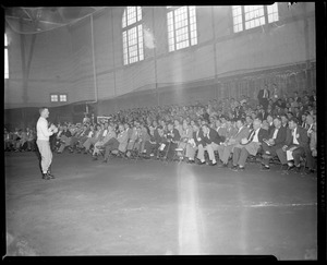 Man lecturing to large group