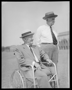 Two older men, one in wheelchair, possibly M.I.T.