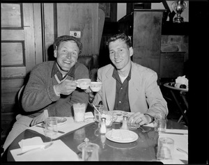 Two men having breakfast in clubhouse