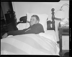 Jimmie Foxx smoking cigar in hotel bed