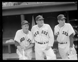 Athletics player poses in dugout with Red Sox players. (Far left Lefty  Grove, Jimmie Foxx 2nd from right) - Digital Commonwealth