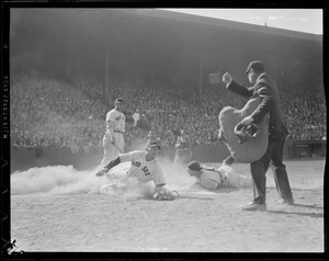 Bill Dickey of the Yankees tags out Red Sox runner at the plate while Jimmie Foxx looks on