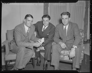 Dom DiMaggio with two men in hotel room