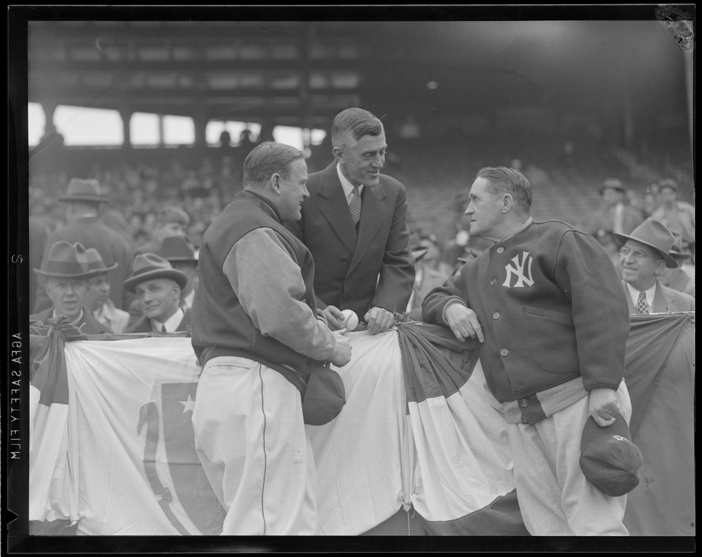 Joe Cronin, Red Sox manager, and Joe McCarthy, Yankees manager, talk with Gov. Saltonstall at Fenway