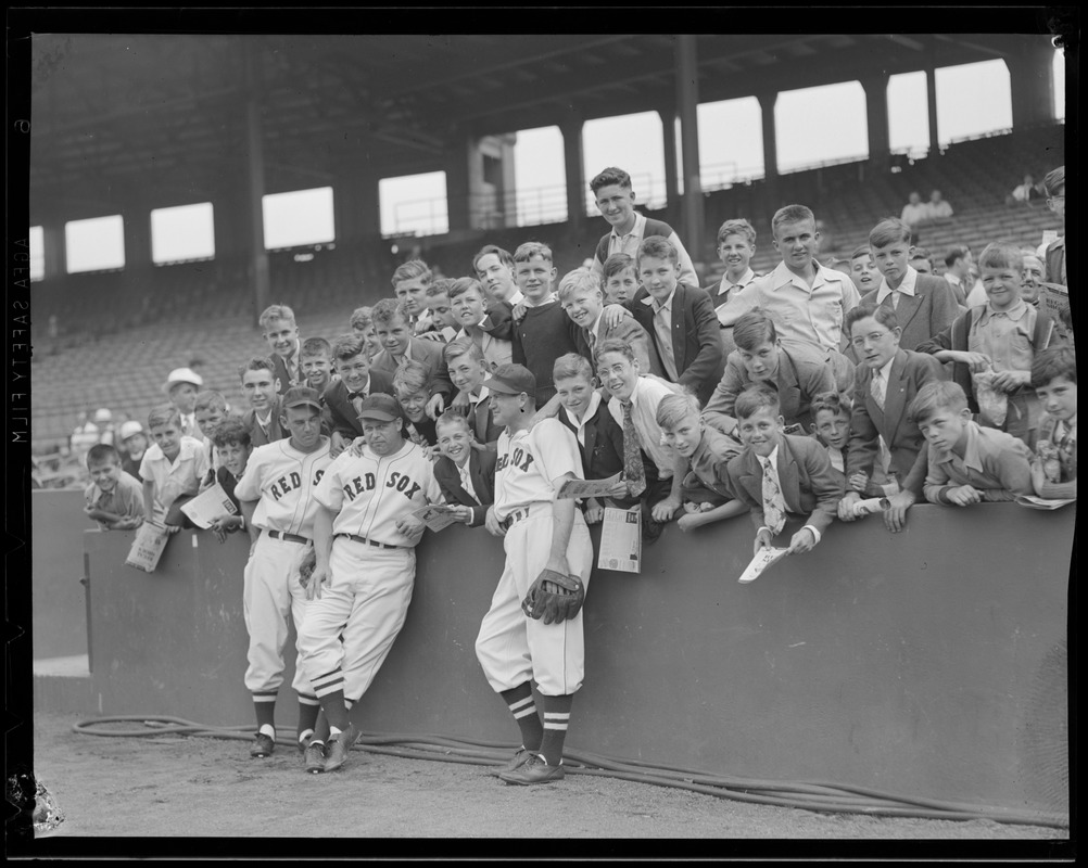 Red Sox players including Foxx and Cronin with group of boys at Fenway