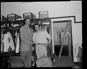 Walt Dropo and Johnny Pesky shake hands in the clubhouse at Fenway