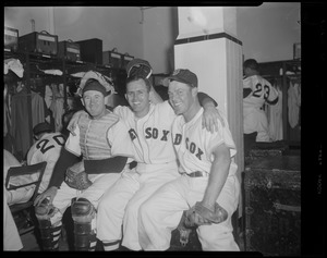 Red Sox players, including Birdie Tebbetts, in clubhouse at Fenway Park
