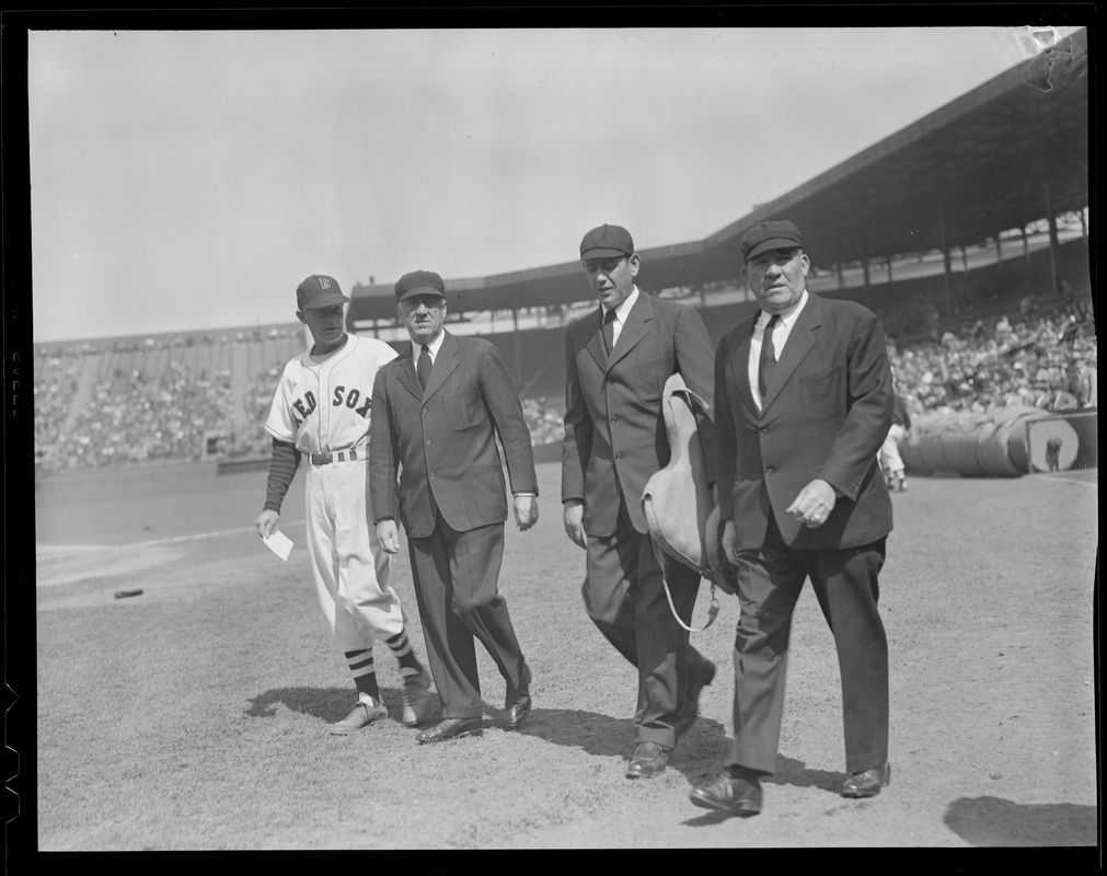 Umpiring crew walks onto field, Fenway