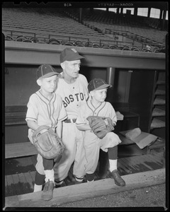 Man in Red Sox uniform with kids