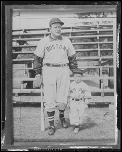 Man and little boy in Red Sox uniforms