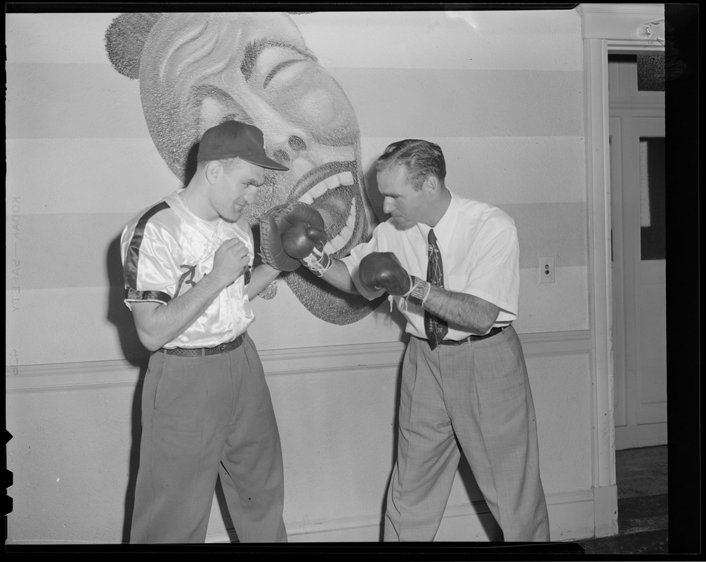 New braves manager, Tommy Holmes, dukes it out with their catcher