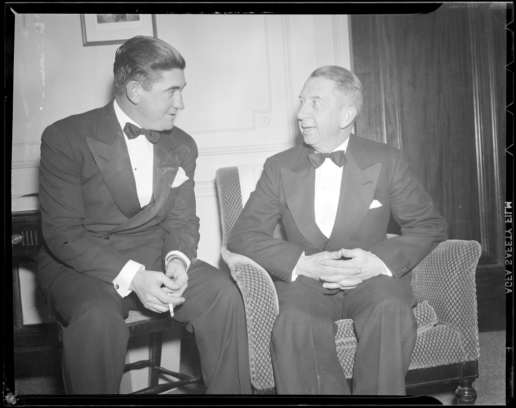 Eddie Collins of the Sox in tuxedo, conversing